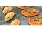Warm snacks and small pizzas on ribbed stainless steel warming plate