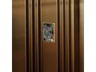 Gold-coloured stainless steel lift door with vertical profile structure and integrated viewing window