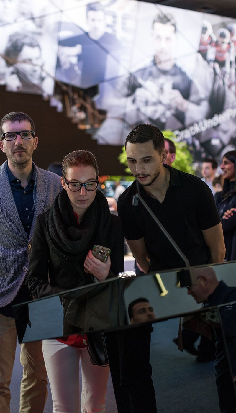 Visitors interacting with Hublot display in Nero SM stainless steel